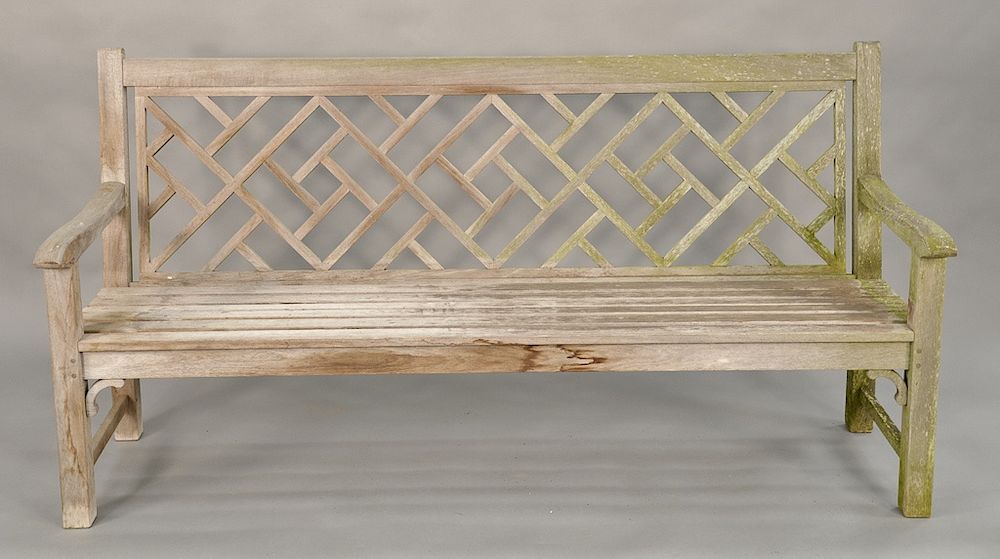 Appraisal: Teak outdoor bench with lattice back ht in lg in