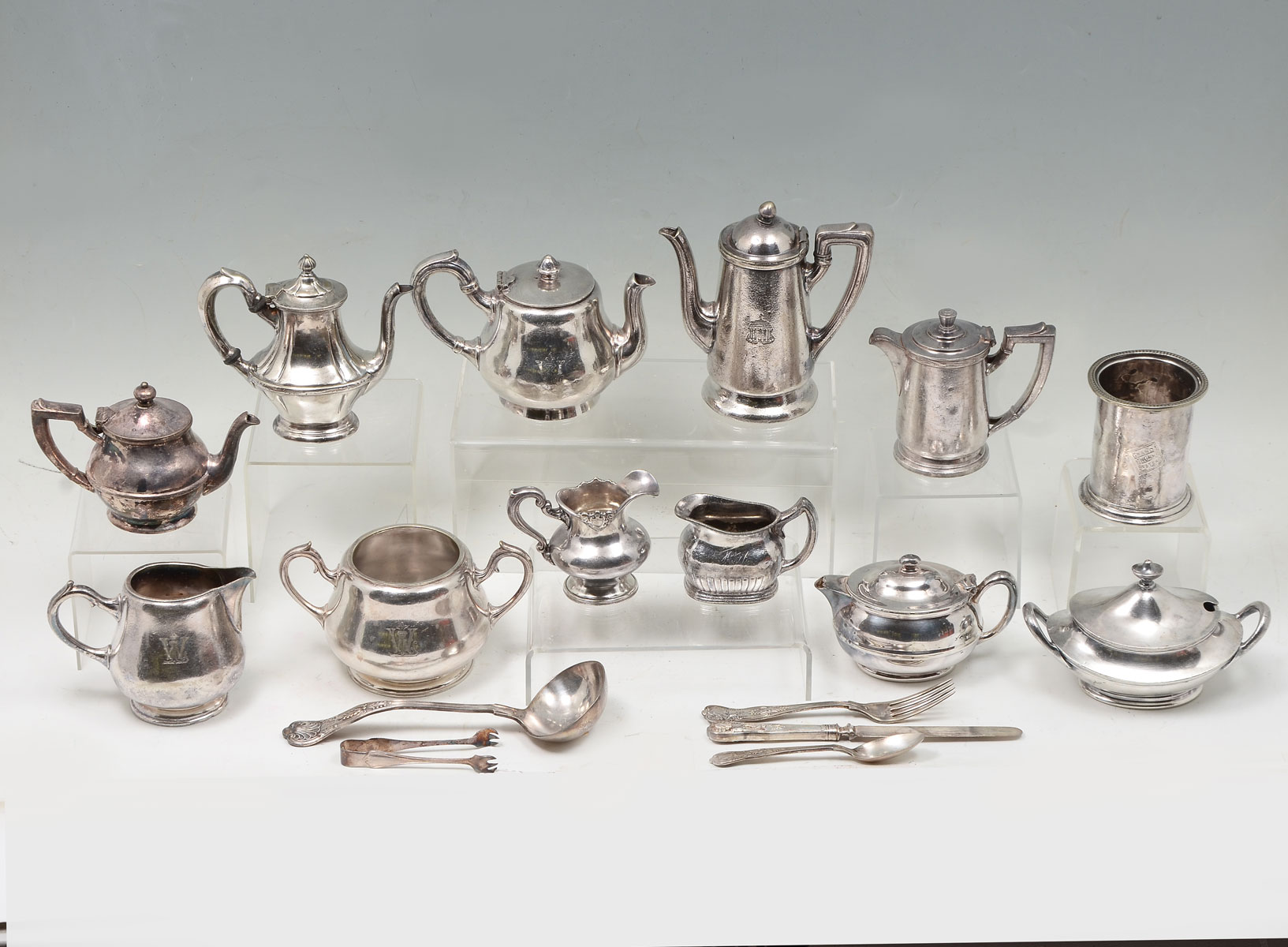 Appraisal: PC RAILROAD SILVER SERVING COLLECTION Comprising Sugar bowls Creamers teapots