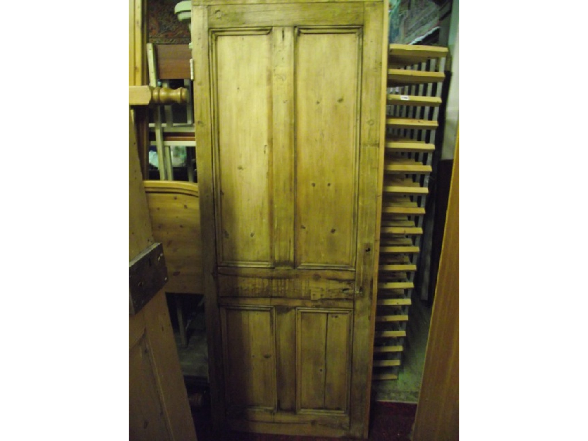 Appraisal: Two reclaimed stripped pine internal doors with moulded panels