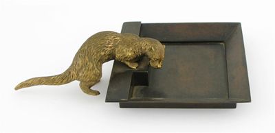 Appraisal: A gilt bronze otter mounted on a square bronze ashtray