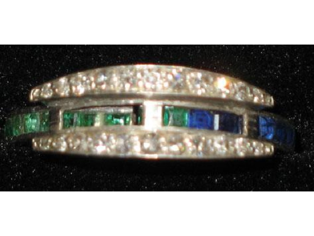 Appraisal: A SAPPHIRE RUBY AND EMERALD ETERNITY RING calibre set with