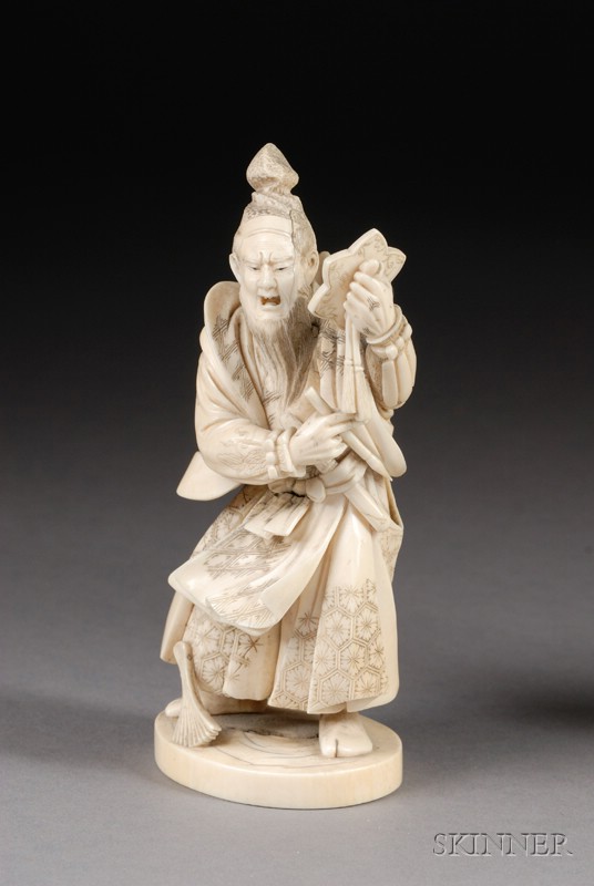 Appraisal: Ivory Carving Japan th century figure of a courtier and