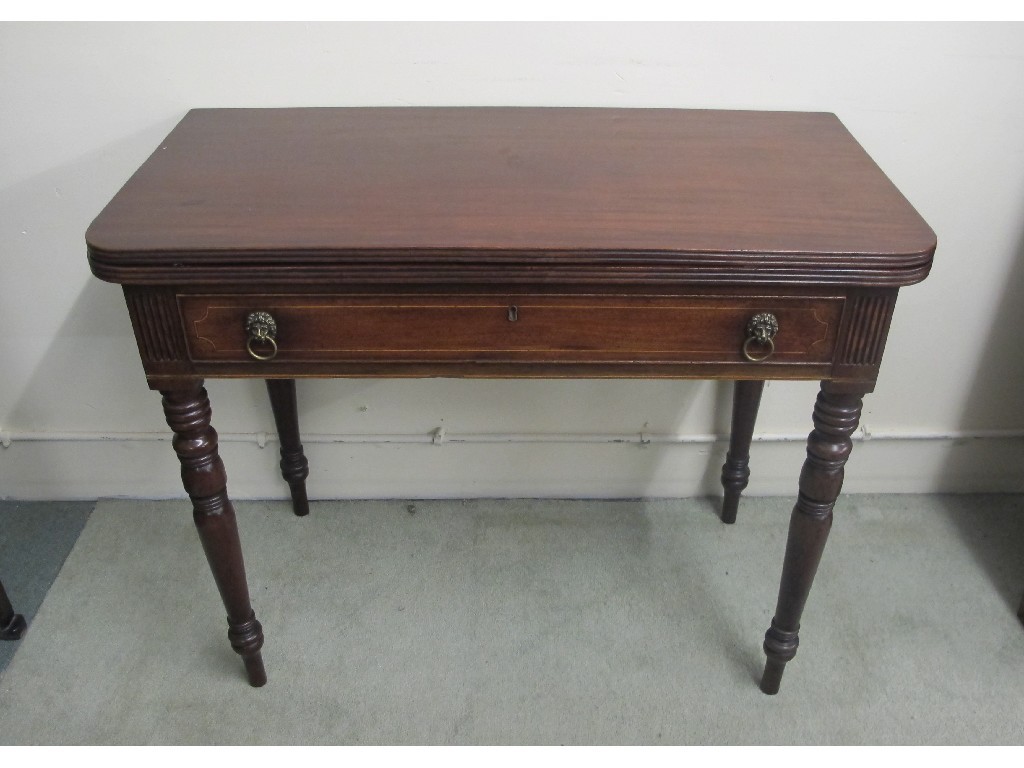 Appraisal: A Victorian mahogany turnover tea table with a single drawer