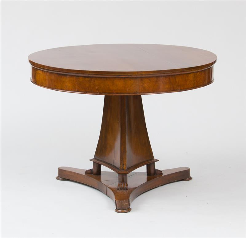 Appraisal: Italian Neoclassical Mahogany Center Table With a circular overhanging top