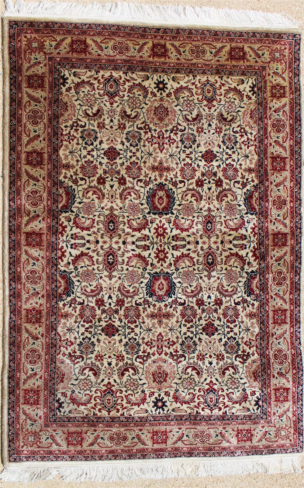 Appraisal: OUSHAK WOOL RUG burgundy taupe and black on a cream