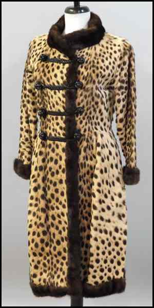 Appraisal: LEOPARD LENGTH COAT Entirely trimmed in brown mink with leather