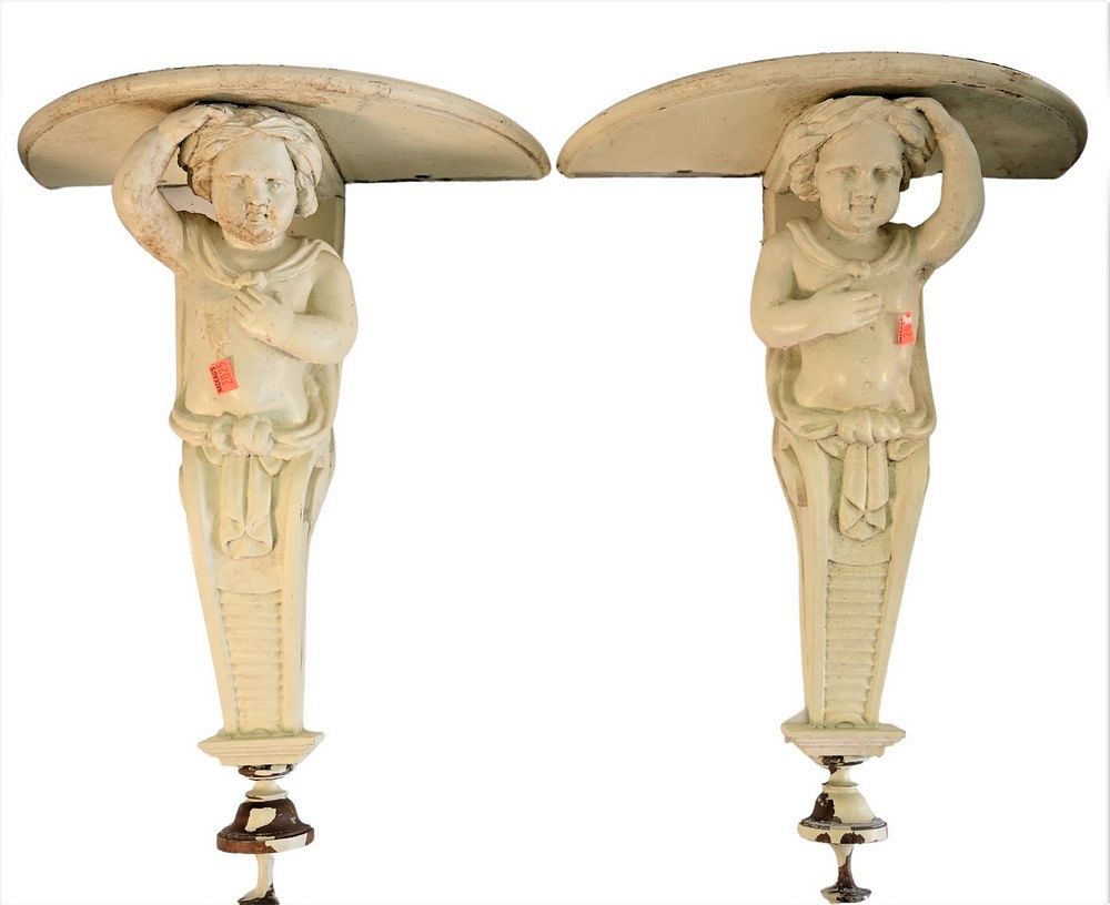 Appraisal: Pair of Carved Wood Bracket Shelves having figural putti supports