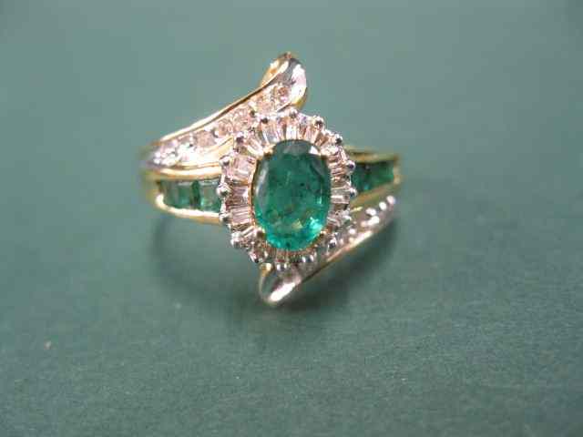 Appraisal: Emerald Diamond Ring oval gem withother emeralds on each side