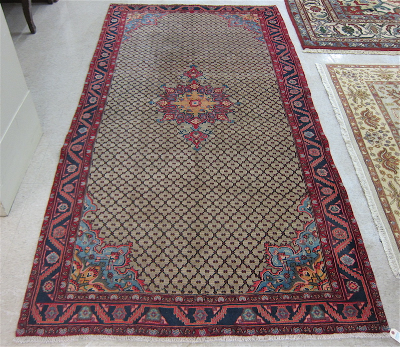 Appraisal: PERSIAN CARPET central medallion and overall diapered tan field hand