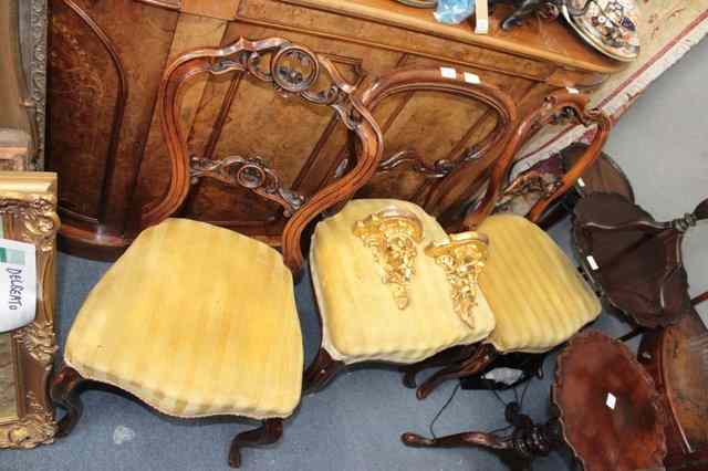 Appraisal: THREE EARLY VICTORIAN BALLOON BACK DINING CHAIRS each with varying