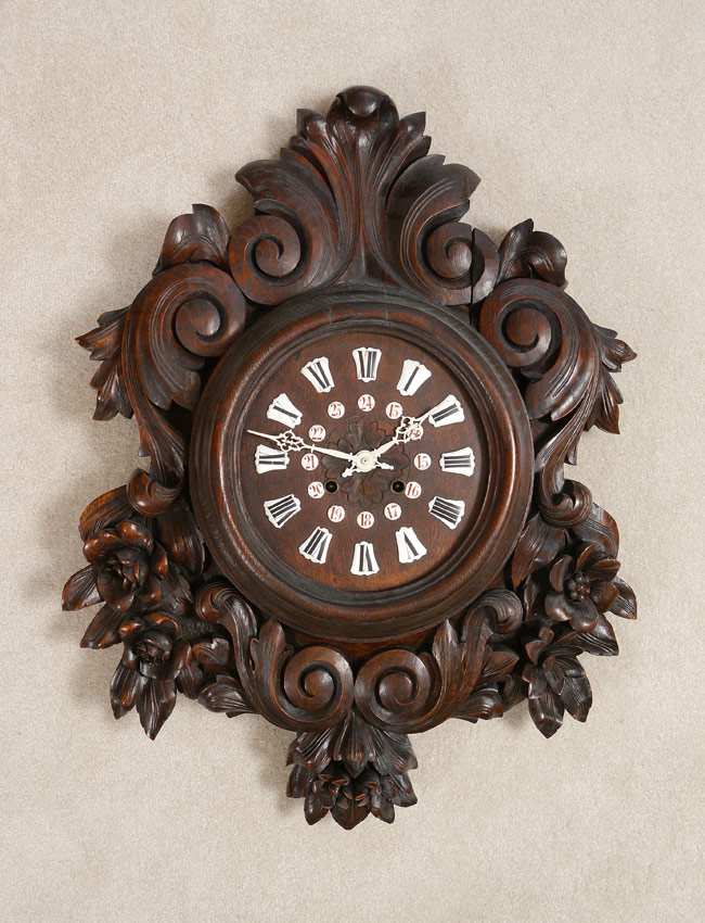 Appraisal: CARVED BLACK FOREST WALL CLOCK Profusely carved all over with