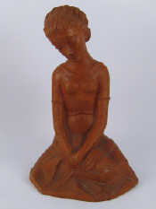 Appraisal: A ceramic figure of a young girl seated on the