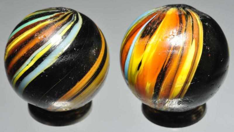 Appraisal: Lot of Indian Swirl Marbles Description Both have degree color