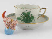 Appraisal: Herend ceramics A cup and saucer with moulded and hand