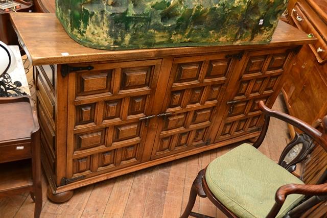 Appraisal: A SPANISH STYLE THREE DOOR TIMBER SIDEBOARD A SPANISH STYLE