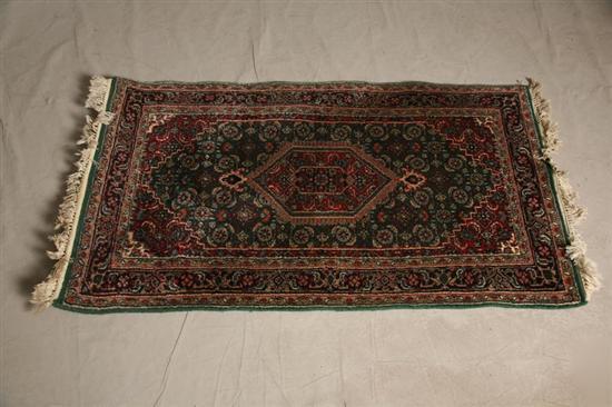 Appraisal: ORIENTAL RUG Red and green field with dark blue borders