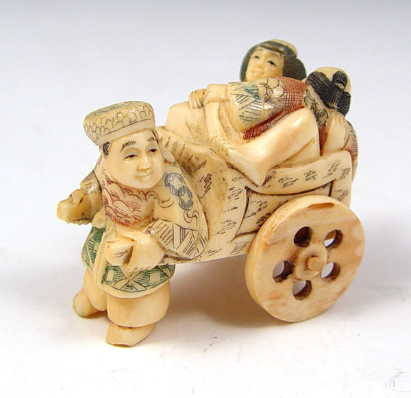 Appraisal: JAPANESE CARVED IVORY RICKSHAW EROTICA NETSUKE Figure of man and