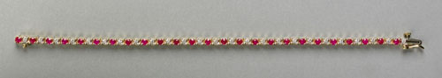 Appraisal: K yellow gold tennis bracelet with diamonds and rubies approx