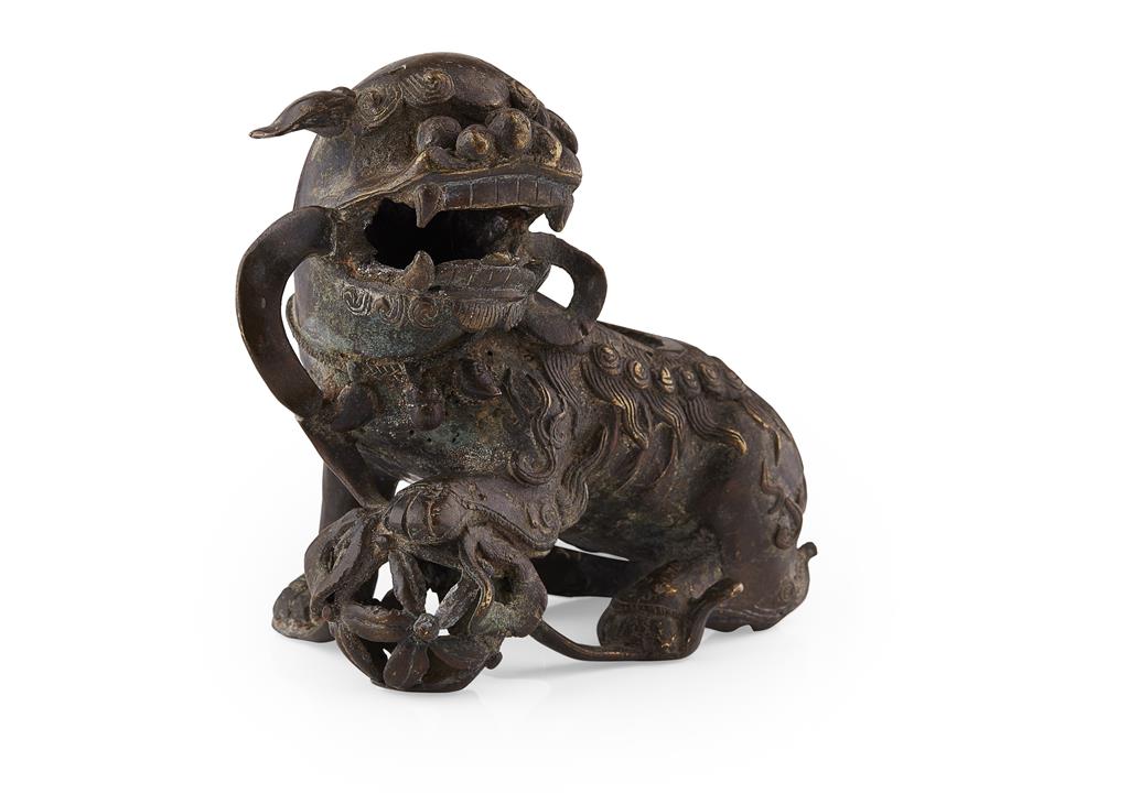 Appraisal: BRONZE CENSER IN THE SHAPE OF A BUDDHIST LION MING