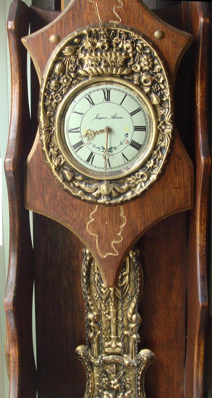 Appraisal: French Morbier style hall clock movement with embossed brass surround