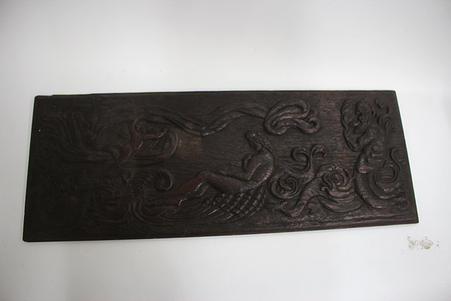 Appraisal: AN ANTIQUE CARVED OAK PANEL depicting a maiden being serenaded