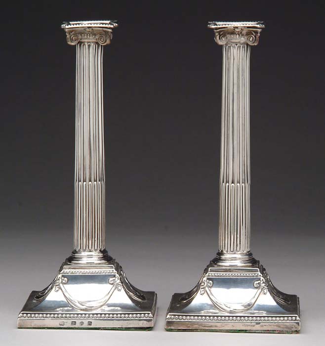 Appraisal: PAIR OF ENGLISH STERLING COLUMN CANDLESTICKS Sticks marked IC either