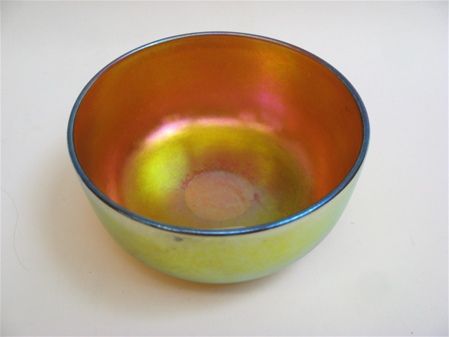 Appraisal: STEUBEN AURENE ART GLASS BOWL Gold iridescent with violet and