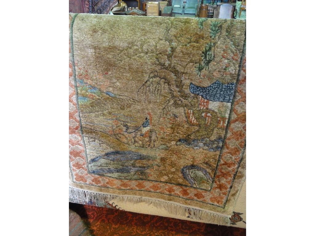 Appraisal: A Chinese silk rug with a village scene with stylised