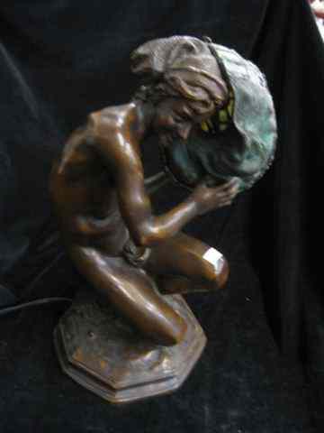 Appraisal: Bronze Figural Lamp with Leaded Glass Shade boy holding a