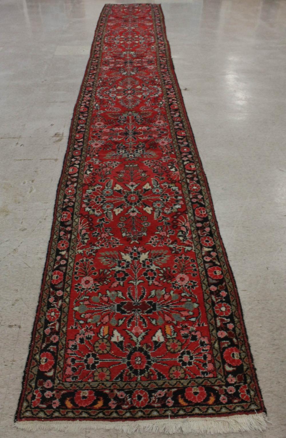 Appraisal: SEMI-ANTIQUE PERSIAN RUNNER Hamandan region western Iran Sarouk floral design