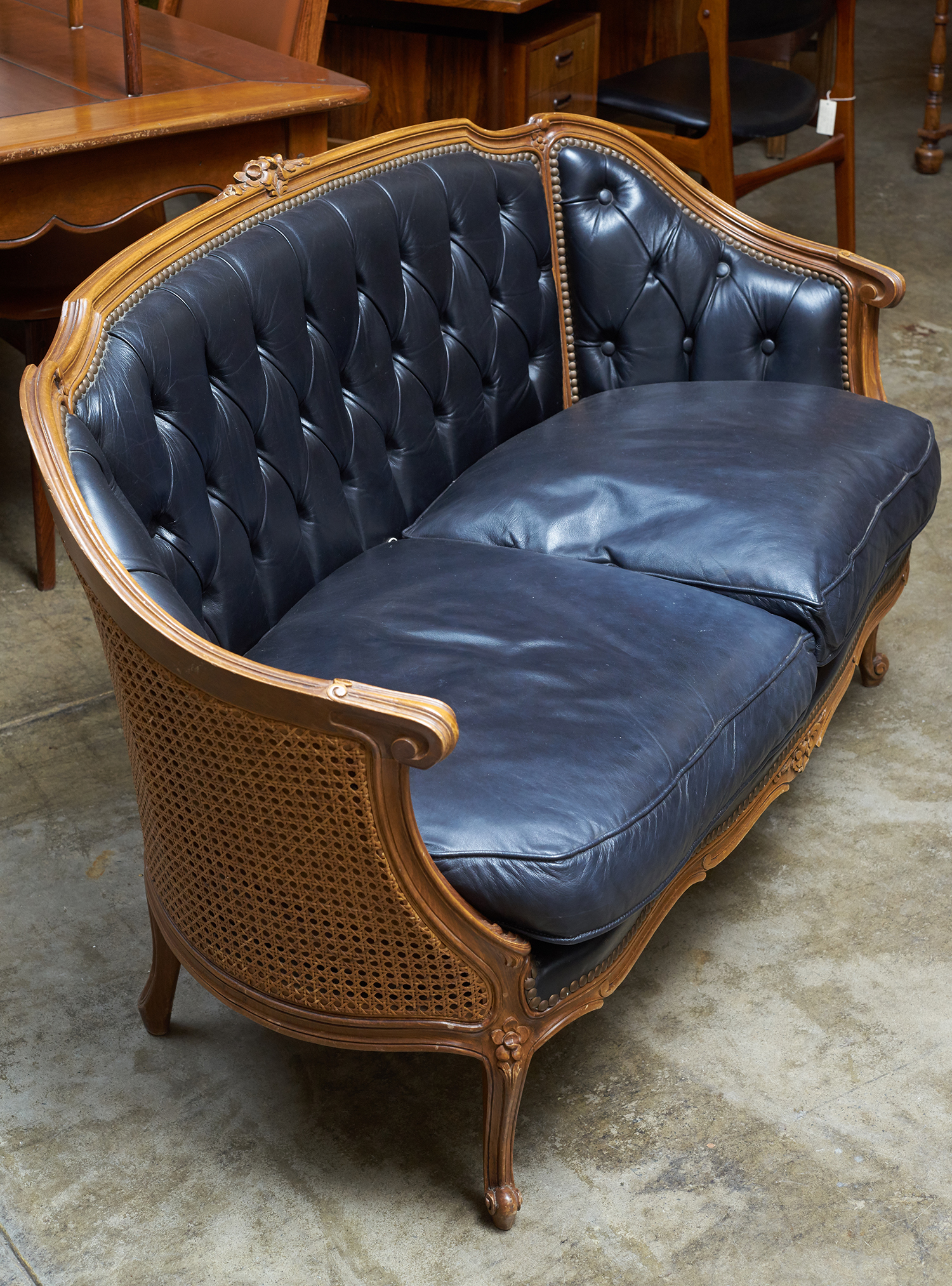 Appraisal: A LOUIS XVI INSPIRED FRENCH TWO SEAT LEATHERETTE CANAPE Button