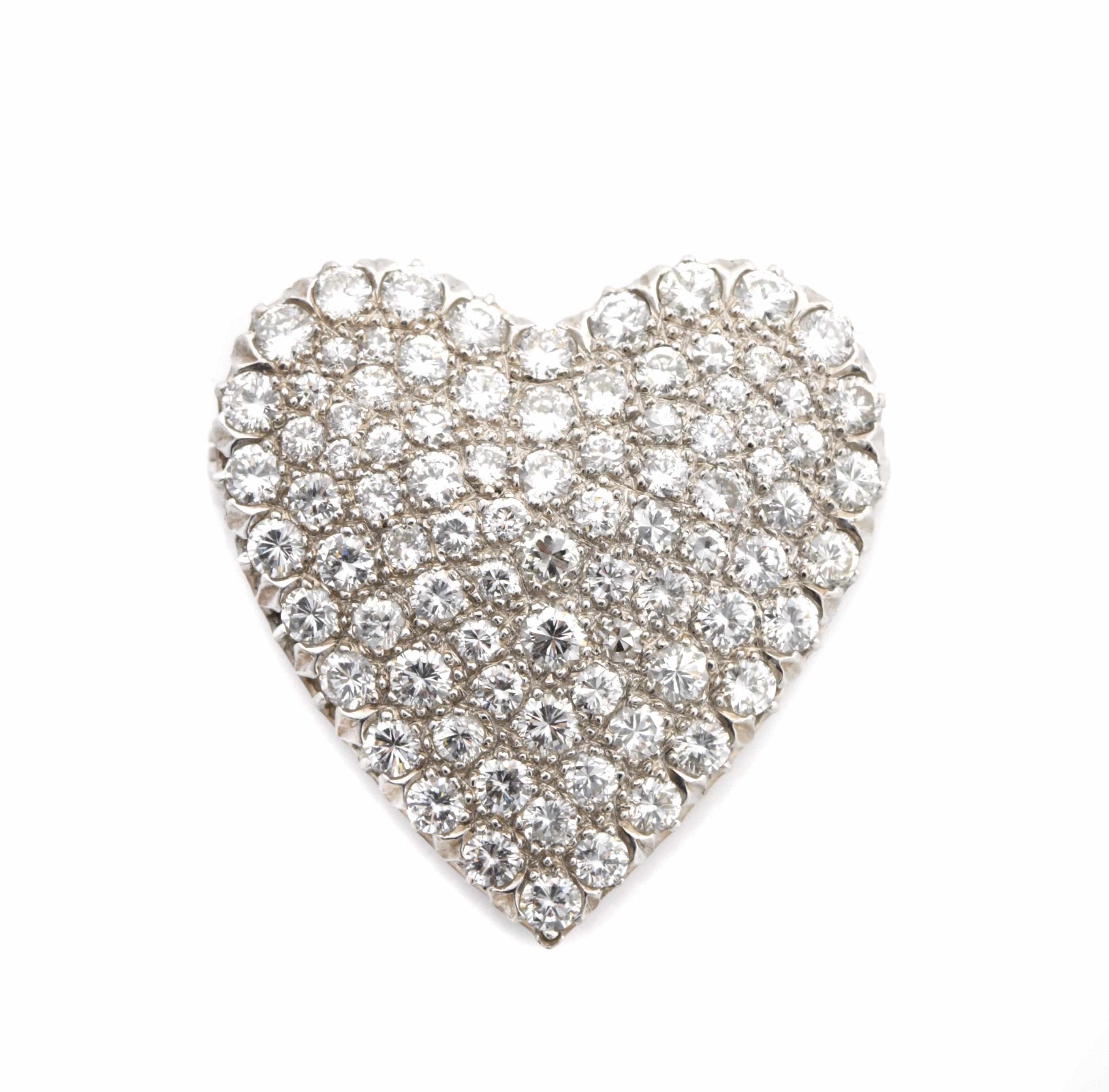 Appraisal: A diamond and platinum heart-shaped brooch estimated total diamond weight