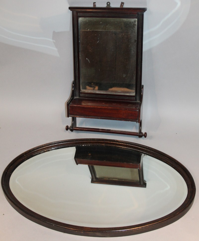 Appraisal: An Edwardian mahogany framed mirror the plain glass above a