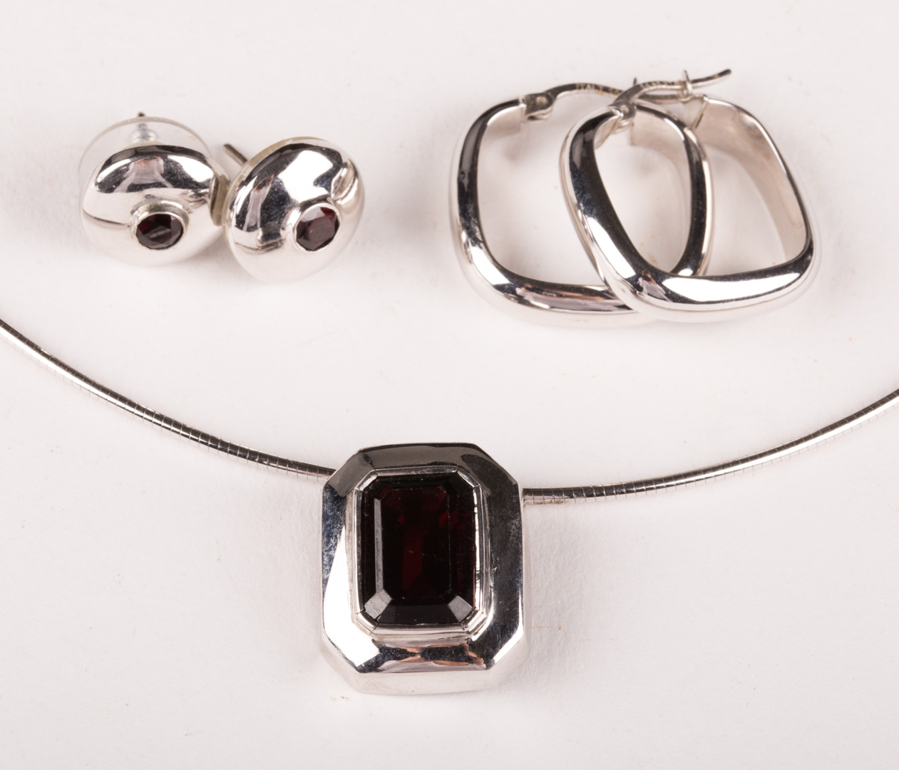 Appraisal: A K White Gold Garnet Necklace and Earrings K white