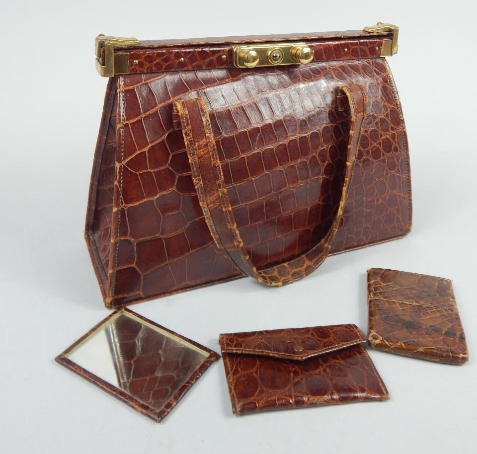 Appraisal: An early thC crocodile style handbag in red with gilt