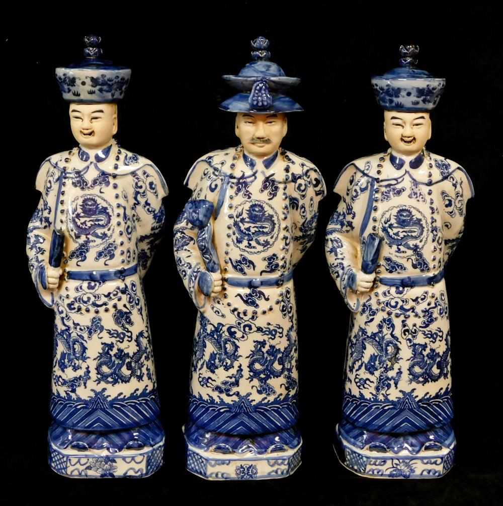 Appraisal: ASIAN Three Chinese porcelain figures of Officials modern blue and