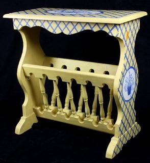 Appraisal: Moderne yellow and blue painted magazine rack the rectangular top