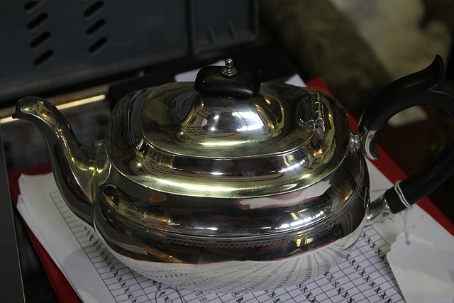 Appraisal: A SILVER TEAPOT of baluster form with shaped ebony handle