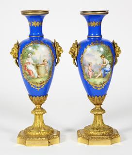 Appraisal: Pair of Sevres style porcelain blue ground vases Pair of