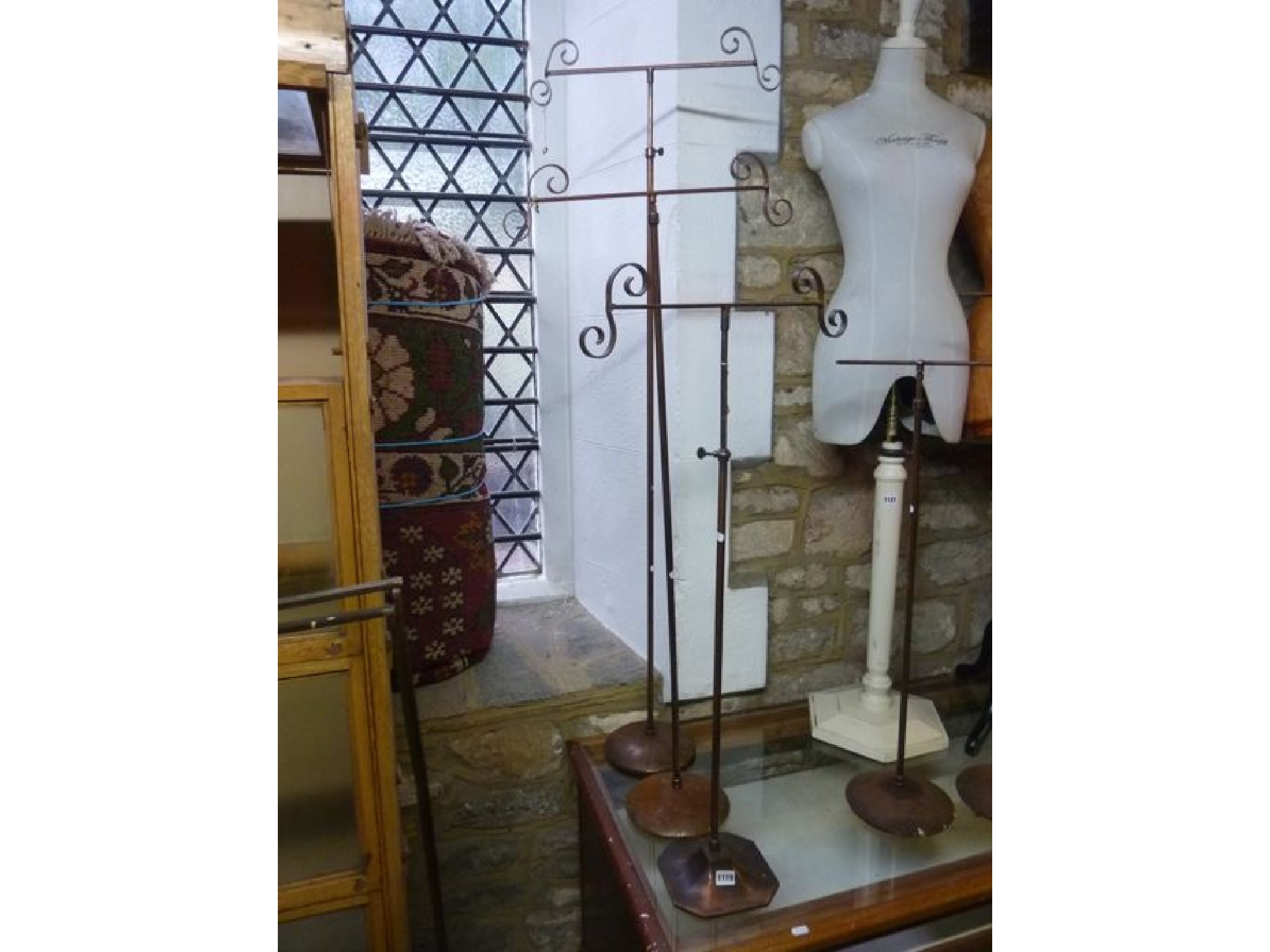 Appraisal: A pair of vintage anodised shop display stands with telescopic