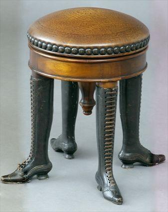 Appraisal: AMUSING ENGLISH BRONZE AND MAHOGANY PIANO STOOL The circular tooled