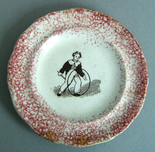 Appraisal: Red spatter toddy plate th c with transfer decoration of