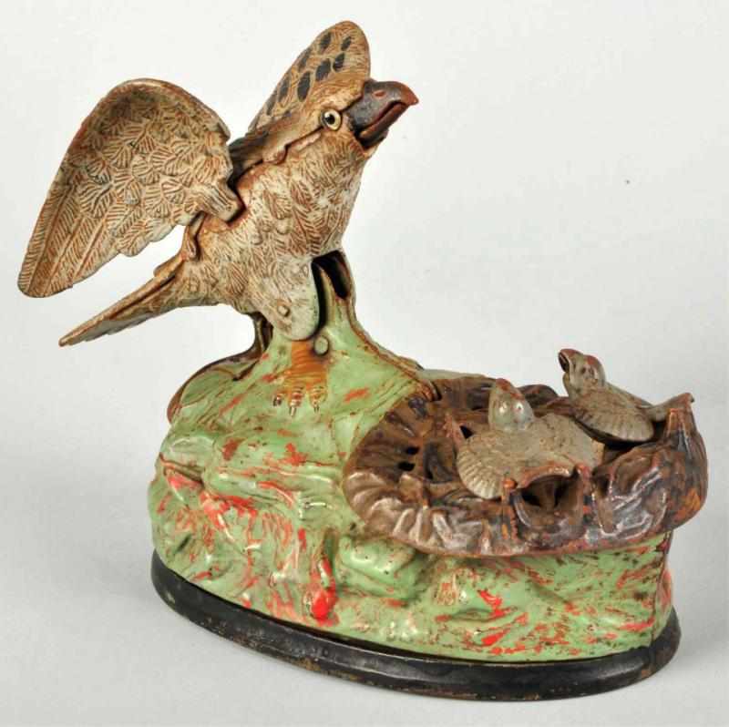 Appraisal: Cast Iron Eagle Eaglettes Mechanical Bank Manufactured by J E