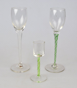 Appraisal: Two liquor glasses with tulip shaped bowls having slender opaque