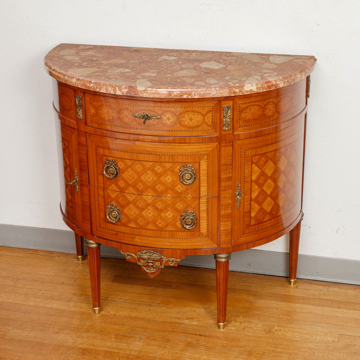 Appraisal: FRENCH PARQUETRY INLAID MARBLE TOP DEMILUNE Parquetry inlaid French Demilune