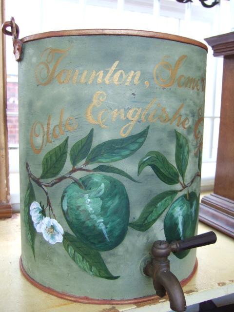 Appraisal: A floral painted cider barrel with brass tap and loop