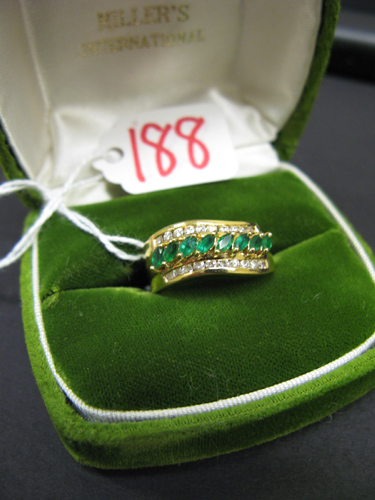 Appraisal: EMERALD DIAMOND AND EIGHTEEN KARAT GOLD RING set with eight