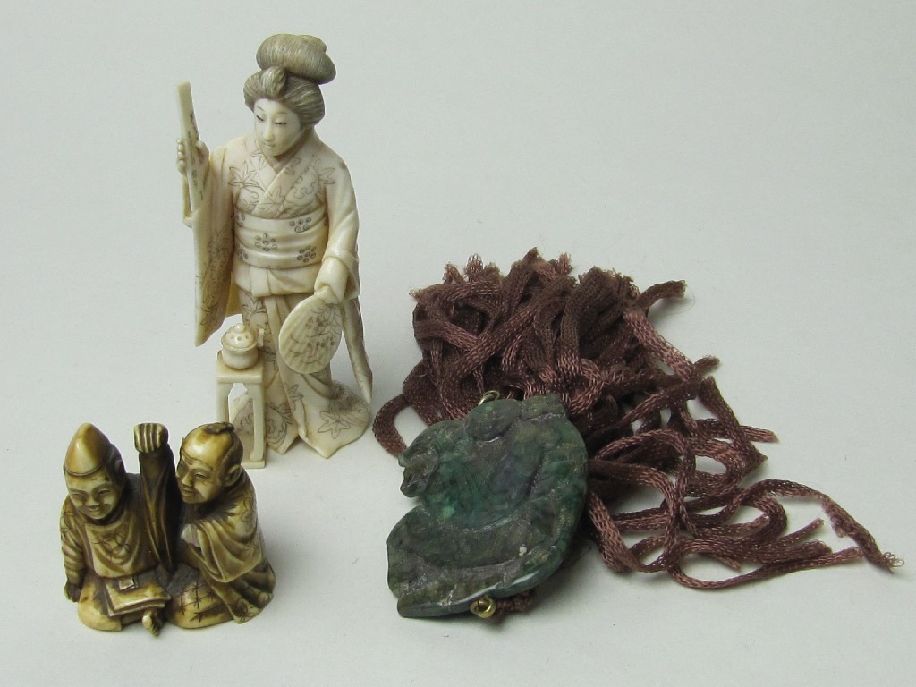 Appraisal: Lot comprising Japanese carved ivory Geisha figure a netsuke and