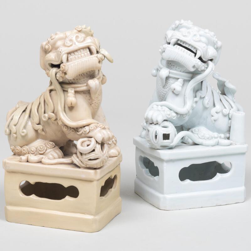 Appraisal: Pair of Chinese White Glazed Porcelain Buddhistic Lion Joss Stick