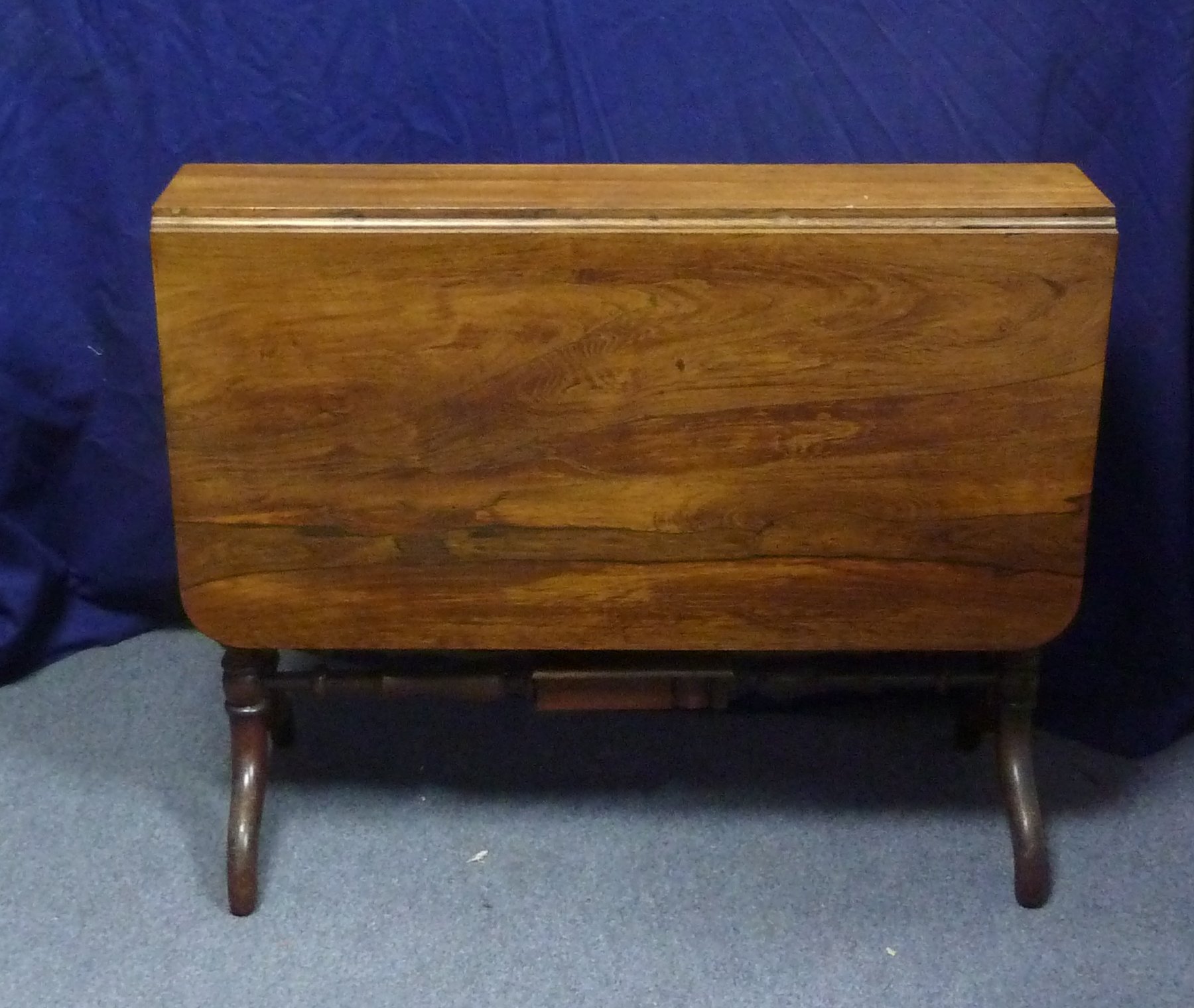 Appraisal: A rosewood two-flap Sutherland table on spiral end columns and